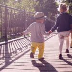 young children on a bridge