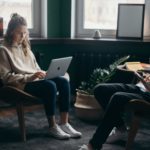 Two people working together in a small home space.