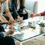 a group brainstorms around a table