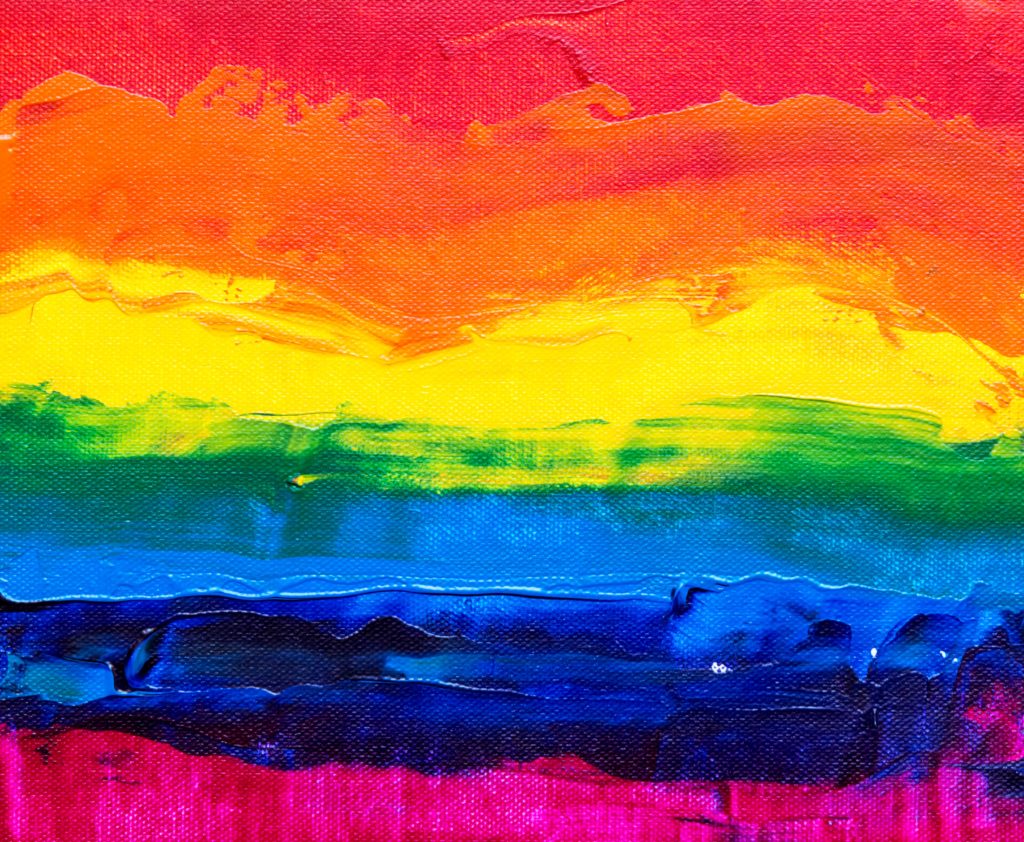 Acrylic abstract painting of rainbow colours across the canvas from top to bottom: red, orange, yellow, green, blue, purple, pink.