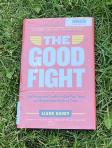 The Good Fight hardcover book on grass